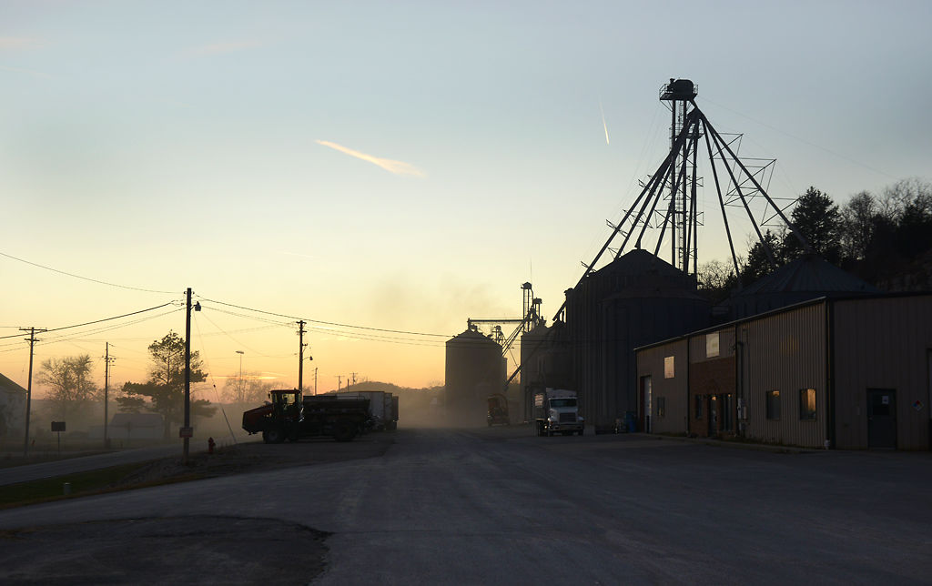Soybean dust fills the air as the sun sets